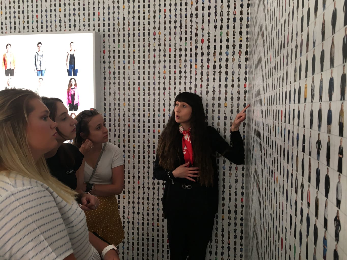 An art museum guide giving a tour.