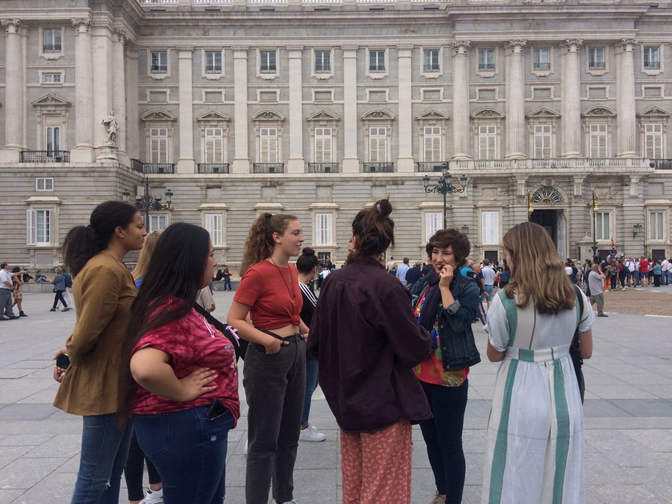 A group of students outside the Royal Palace of Madrid.