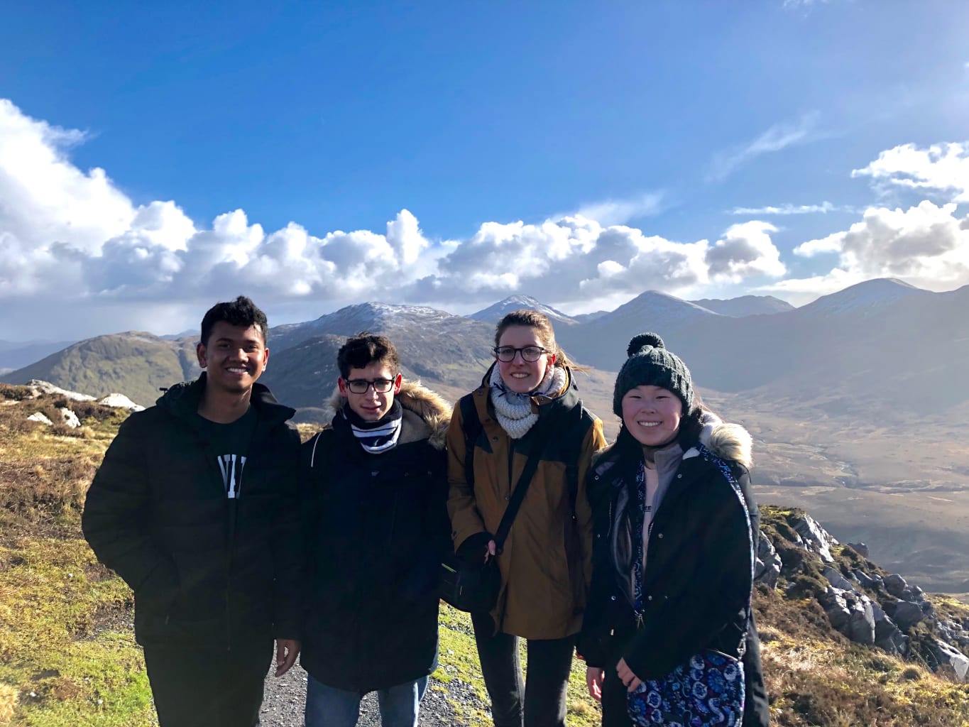 Four students on a mountain in Ireland.