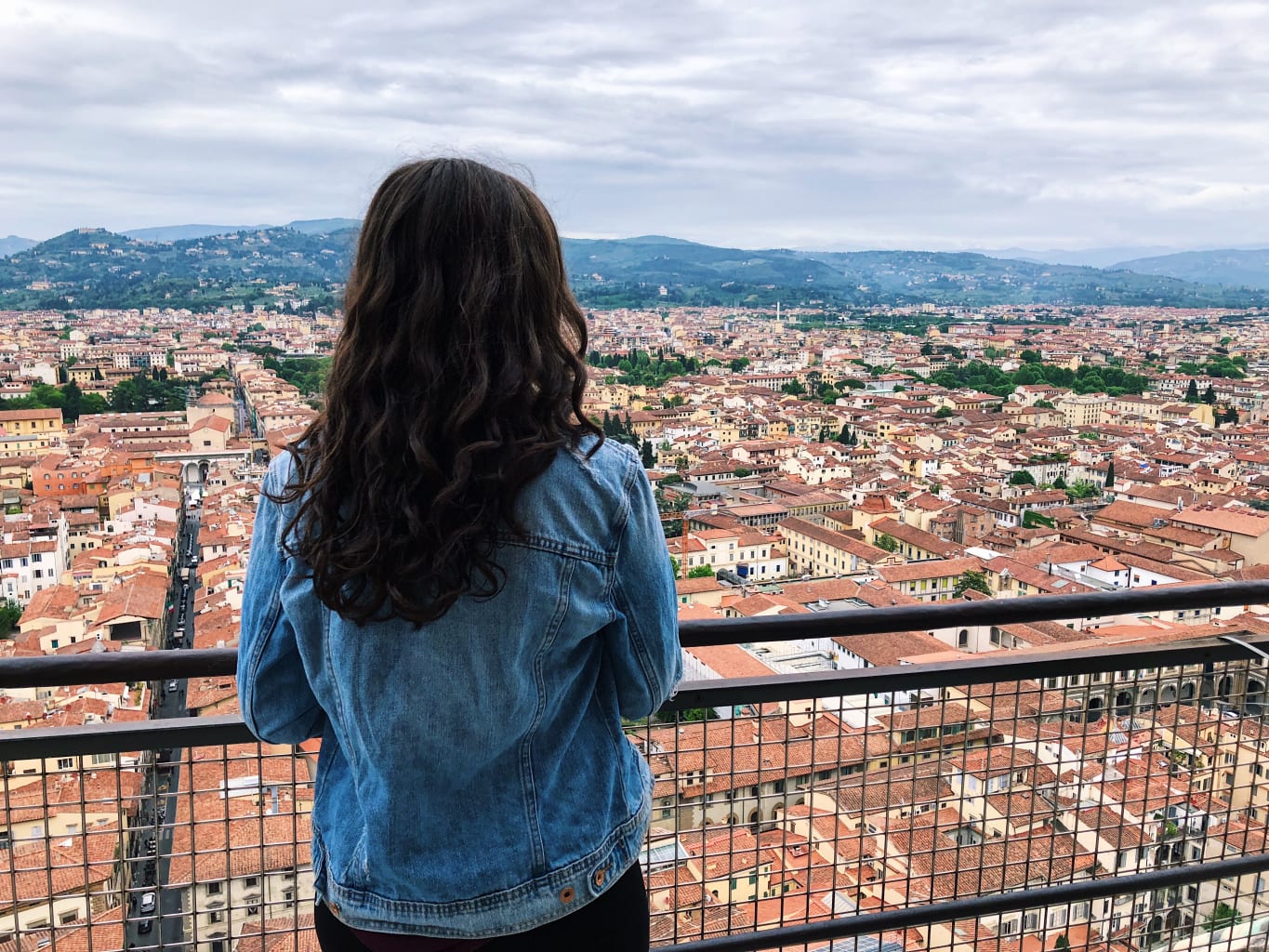 A student overlooking a view of Florence, Italy.