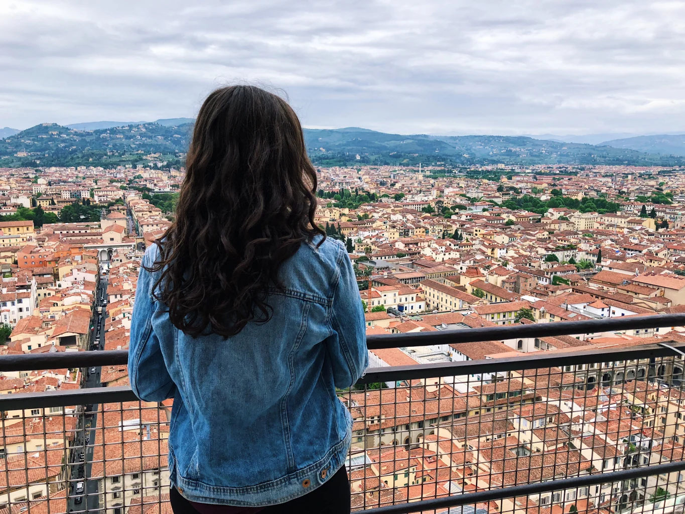 A student overlooking a view of Florence, Italy.
