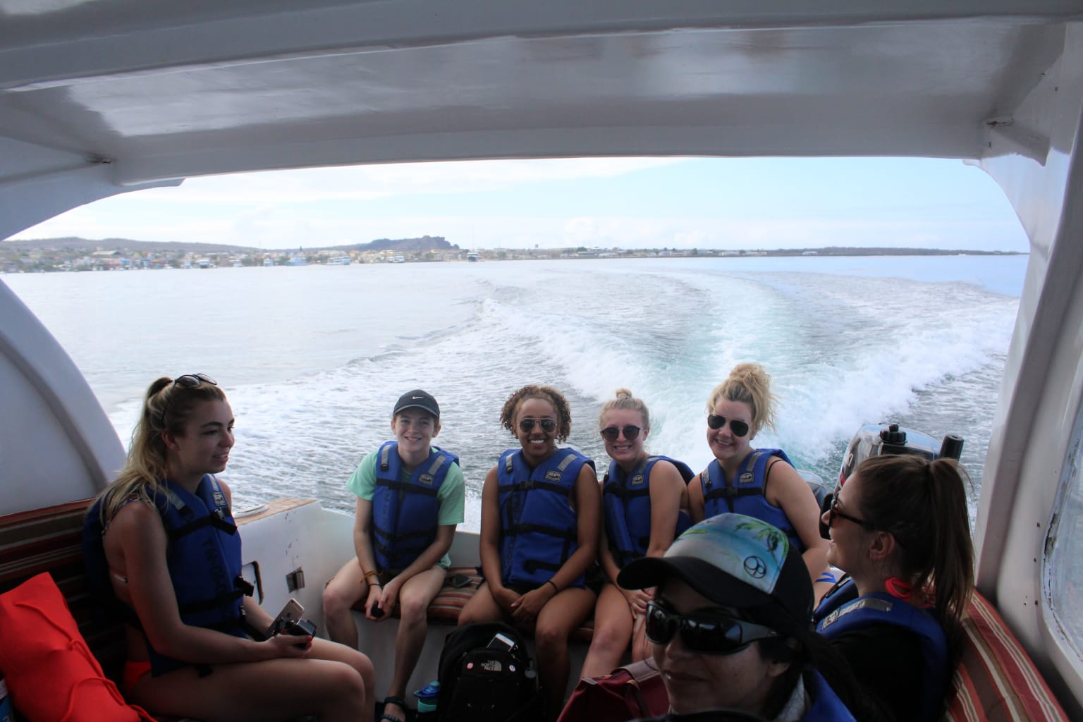A group of students on a boat.