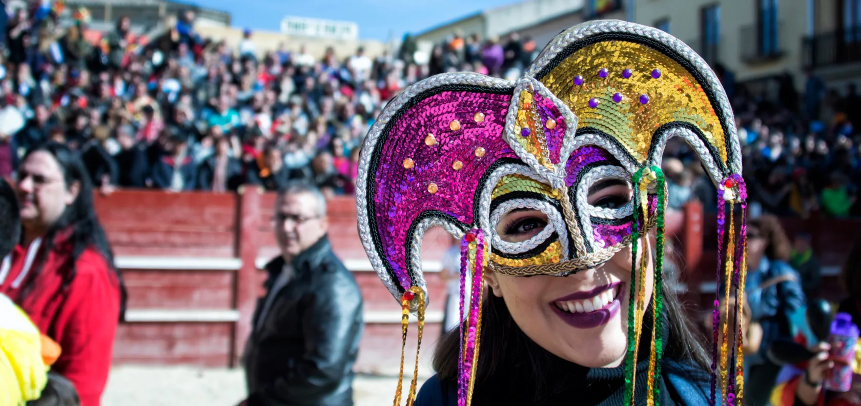 Girl wearing mask with sparkles.
