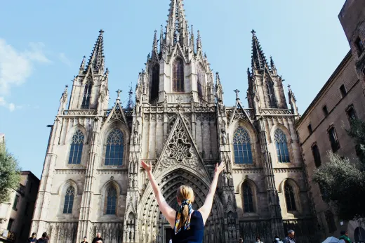 A student in front of Barcelona Cathedral.