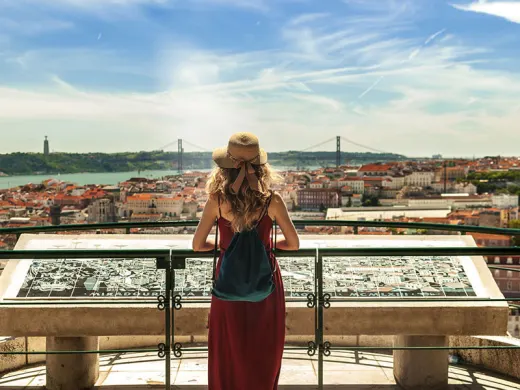A student admiring a view of Lisbon, Portgual.