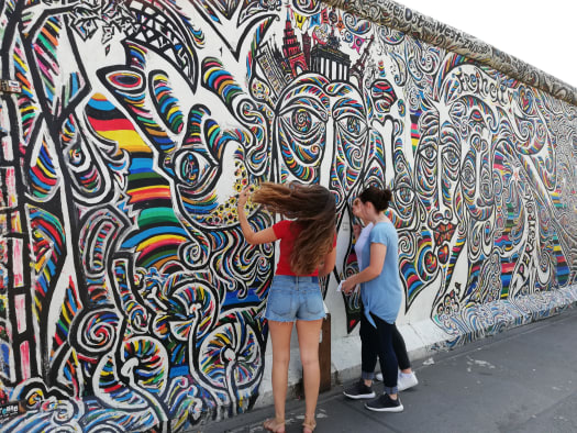 Students looking at a mural in Spain.