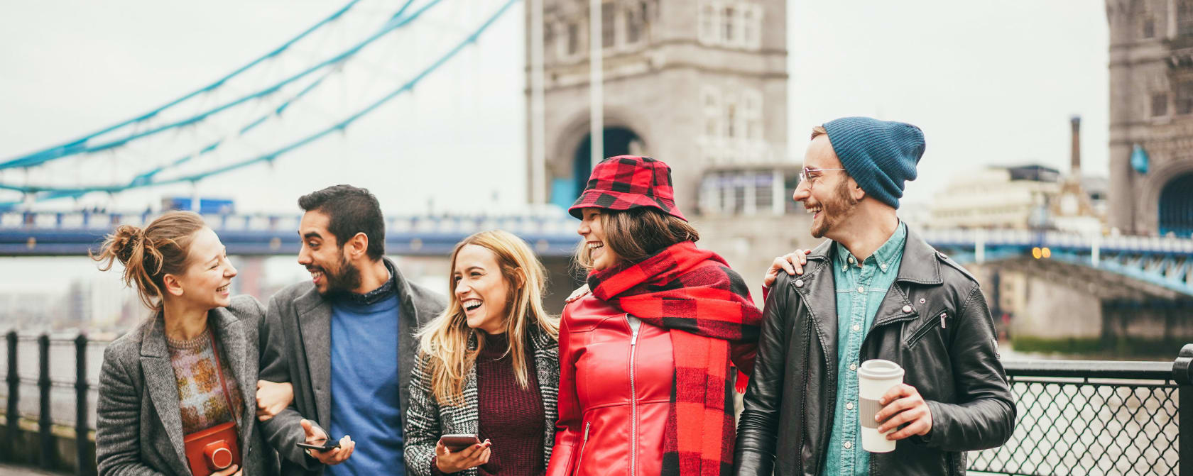 Group of students standing in front of the Tower Bridge in London, England.