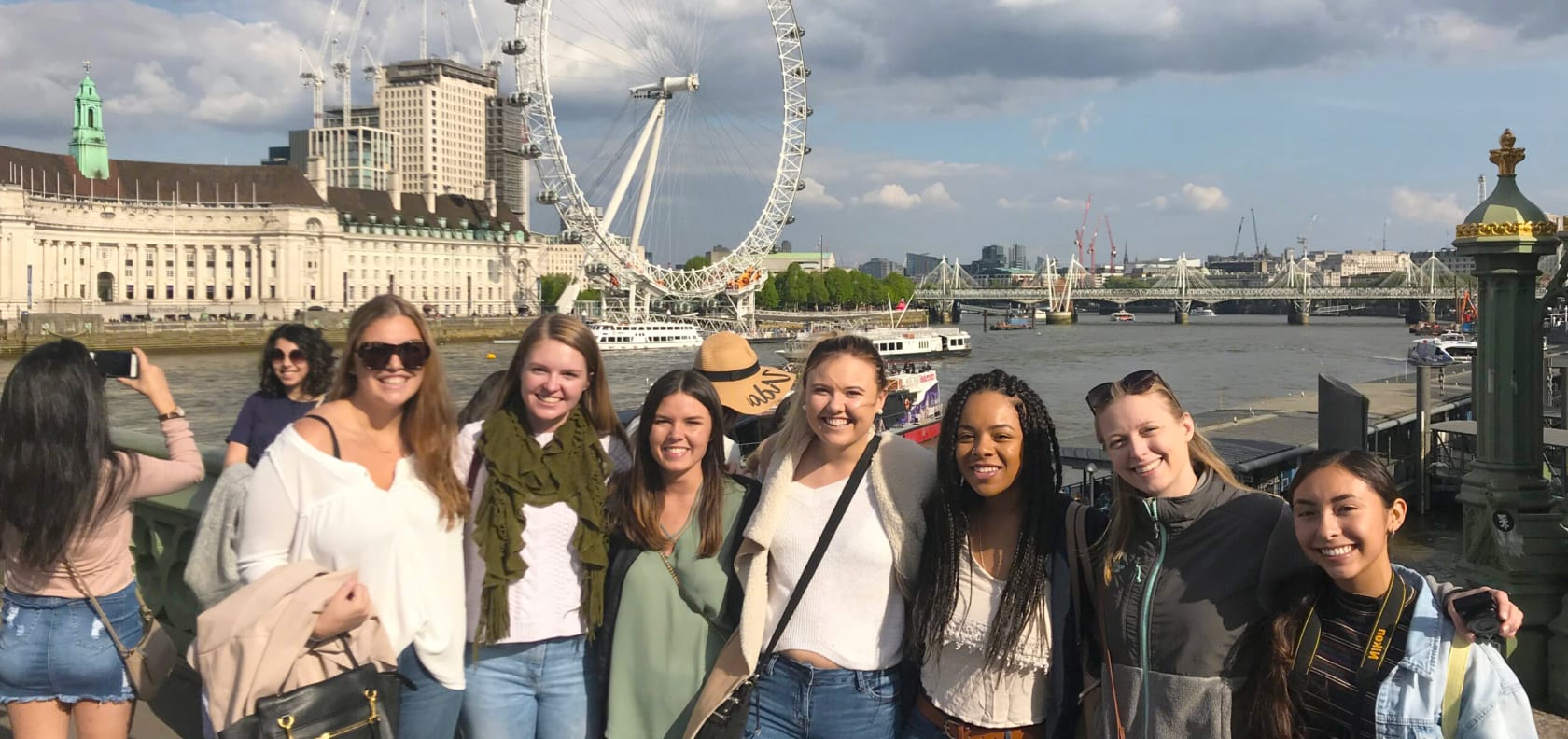 A group of students on a bridge in London.