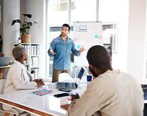 Young professional leads a brainstorming session.
