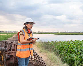 Woman assesses water quality.