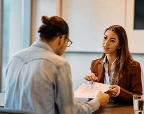 Human resources worker meets with employee