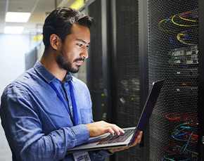 Man works in a data center