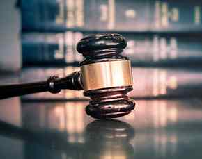 Gavel sitting in a law liibrary