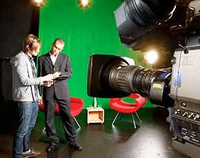 Video production professional prepares for taping