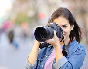 Woman holding a camera.