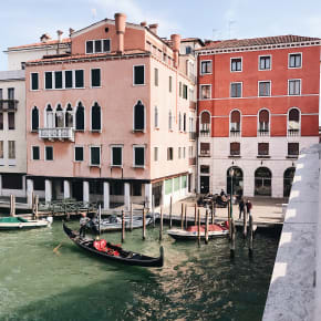 Pinik buildings and gondolas in Italy.