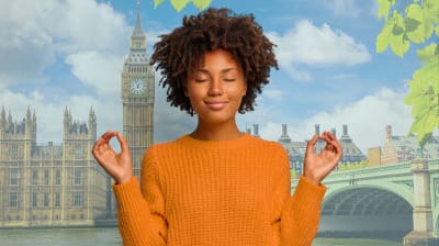 Young woman mindfully meditating with London in the background