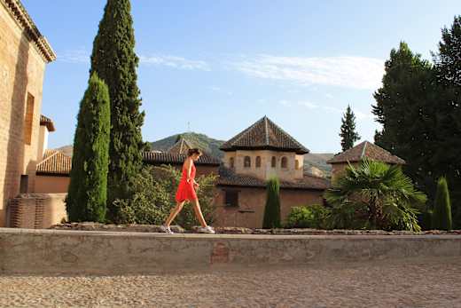 Girl walking on wall.