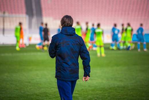 Football trainer on the field.