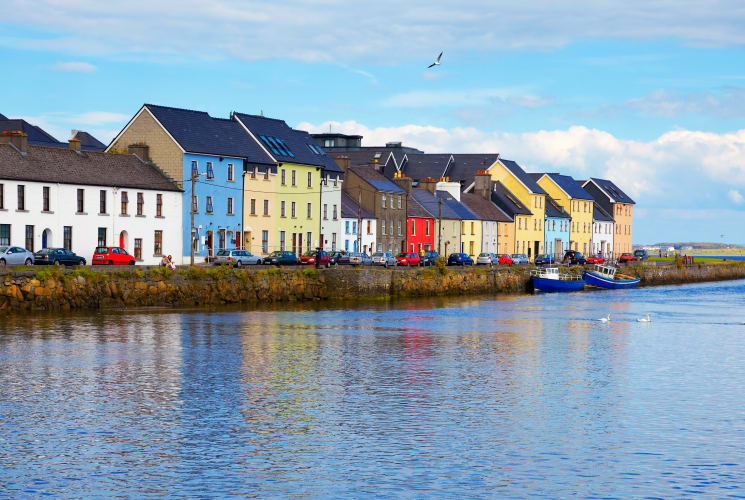 Colorful buildings along the coast in Galway, Ireland.