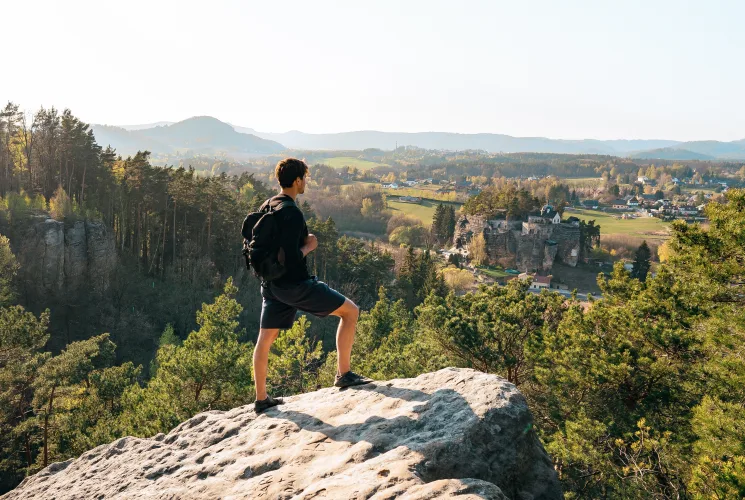 A student standing on a cliff overlooking Bohemian Switzerland National Park.