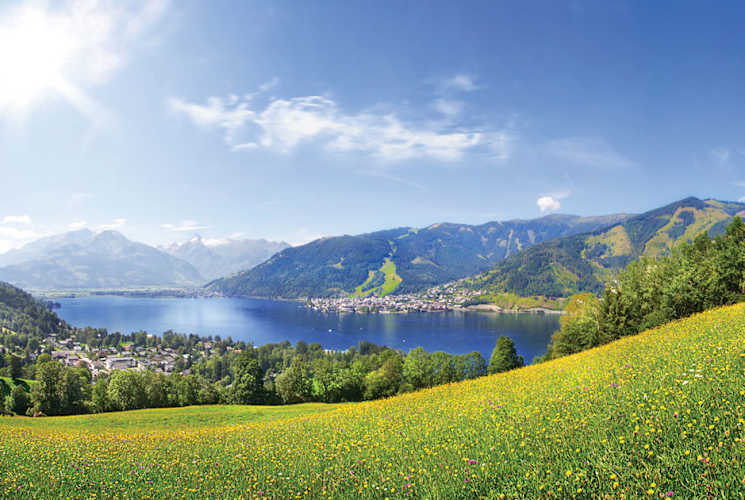 A lake surrounded by green fields.