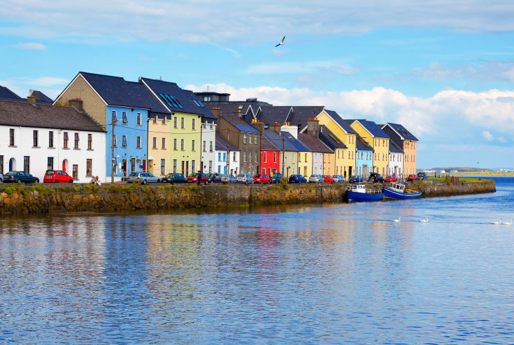Colorful buildings along the coast in Galway, Ireland.