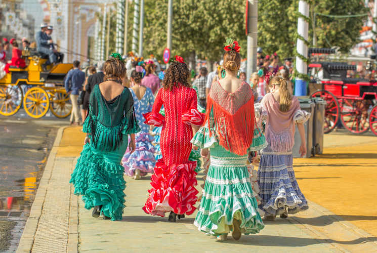 Women in traditional dress in Seville, Spain.