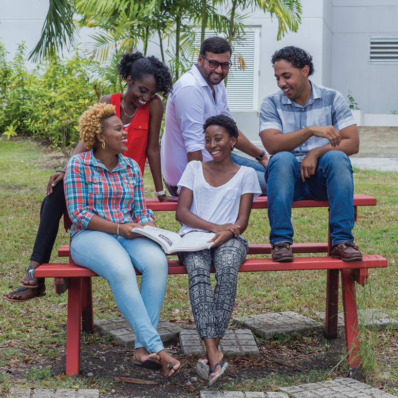 A group of students on a bench.